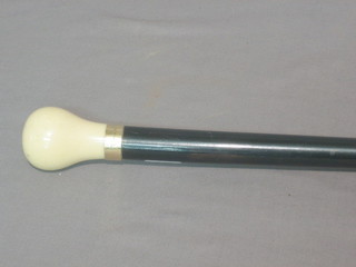 A 19th Century ebony evening cane with 9ct gold band and ivory knob
