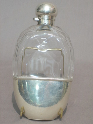 A Victorian oval cut faceted glass hip flask with silver collar and detachable cup, London 1886