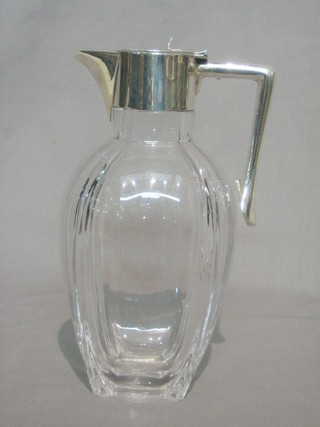 An Edwardian Dresser style glass claret jug with silver collar London 1902 (marks rubbed)