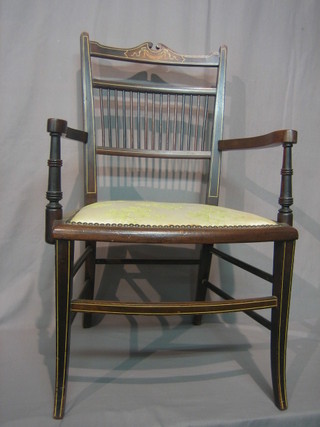 An Edwardian inlaid mahogany stick and rail back open arm chair