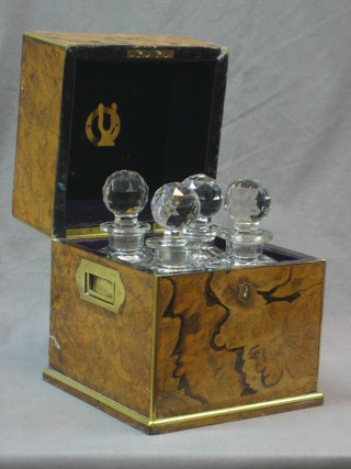 A handsome 19th Century figured walnut and brass banded decanter box containing 4 spirit decanters by Griffin, with brass campaign handles to the side and engraved Percy Court (lid cracked and 2 decanters damaged due to Tornado whilst out East) 8"