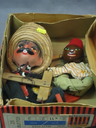 A puppet of a Spaniard and 1 other Egyptian