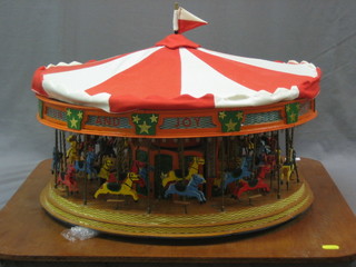 A large electrically operated model carousel 21"