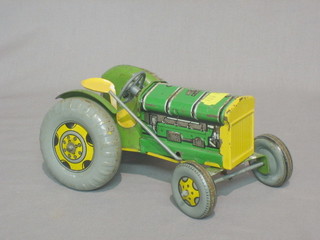 A Mettoy tin plate model of a tractor together with a model of a motor car, boxed