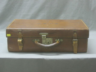 A leather suitcase with chrome fittings