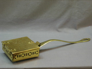 A square brass chestnut roaster with hinged lid