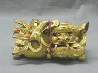 An Oriental carved figure of a lion 8"