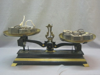 A pair of Continental brass and iron pand scales complete with 10 weights 50 grams - 2