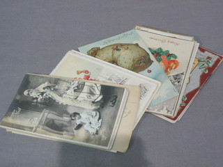 A collection of various black and white and other postcards