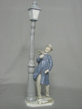 A Lladro figure The Lamp Lighter (thumbs f and missing light) 18"