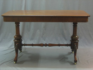 A Victorian mahogany stretcher/library table raised on turned columns with H framed stretcher 48"
