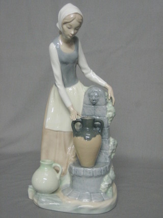 A Nao figure of a standing lady at well head with 2 pitchers 11"