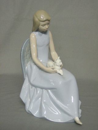 A Nao figure of a seated girl with cat 10"