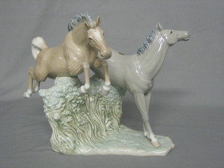 A Nao figure of 2 jumping horses 9"