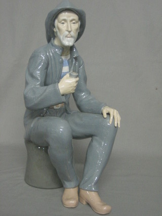 A Nao figure of a seated fishermen with pipe 15"