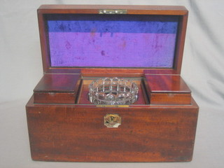 A 19th Century rectangular mahogany twin compartment tea caddy with hinged lid, the interior fitted a pair of tea caddies and complete with glass bowl, having a brass carrying handle 12" (brass escutcheon missing)
