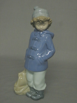 A Nao figure of a standing duffel coated girl with haversack 7"