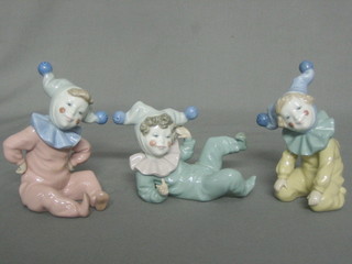 3 Nao figures of reading and reclining clowns 6"