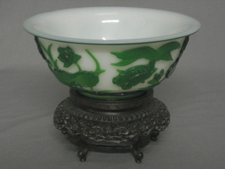 A 19th Century Beijing white and green oval glass bowl decorated a plaque, the base with 4 character mark 6 1/2", raised on a pierced hardwood stand