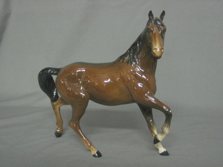 A Beswick figure of a standing bay horse with front right hoof crooked 8 1/2"