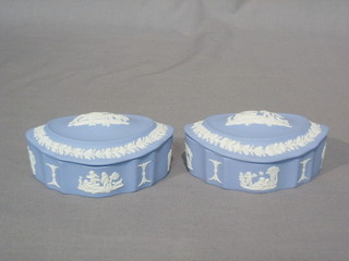 A pair of Wedgwood blue lustre oval shaped trinket boxes and covers, base marked Wedgwood England 4"