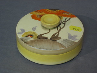 A Clarice Cliff style circular pottery jar and cover 5"