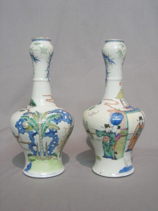 A pair of 19th Century Oriental bottle shaped vases, the base with 6 character mark, decorated court figures 12" (1 f and r)