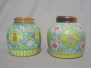 A pair of Oriental green glazed pottery ginger jars with hardwood covers 8"