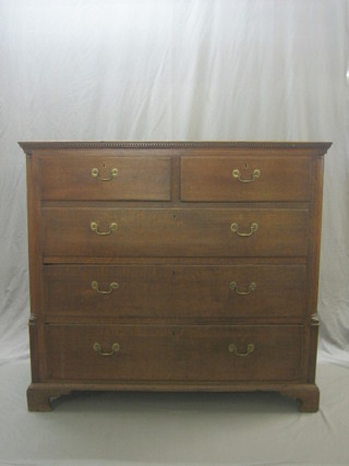 A 19th Century oak chest with dentilled cornice, fitted 2 short and 3 long drawers with canted reeded corners, raised on bracket feet 53"