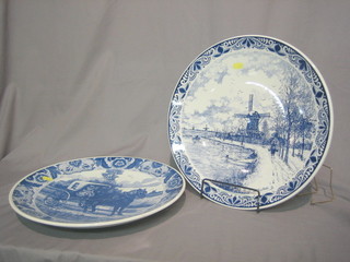 2 Dutch blue and white pottery chargers decorated Windmill and cart