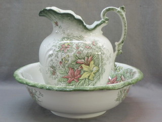 A green and white floral patterned pottery jug and bowl set