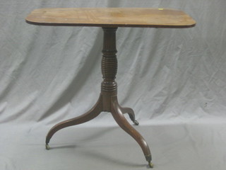 A 19th Century rectangular snap top mahogany occasional table raised on pillar and tripod supports ending in brass caps and castors 32"