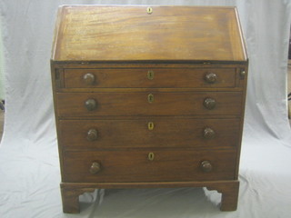 A 19th Century mahogany bureau the fall front revealing a well fitted interior above 4 long drawers, raised on bracket feet 36"
