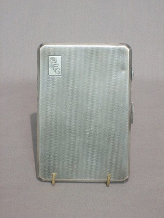 An Art Deco silver cigarette case with engine turned decoration Birmingham 1943 6 ozs