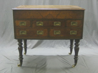 A mahogany enclosed washstand with hinged lid, the base fitted 3 long and 2 short drawers, raised on turned supports 36" (made up)