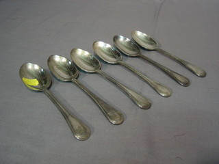 A set of 6 Victorian silver Old English thread pattern table spoons with armorial decoration, London 1860 18 ozs