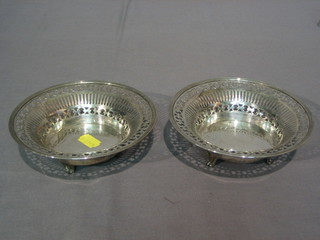 A pair of circular pierced silver bowls raised on 4 panelled supports London 1920 by the Goldsmiths and Silversmiths Company 8 ozs