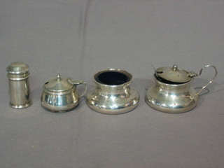 A circular silver mustard pot and matching salt, Birmingham 1920 and 1 other salt and pepper