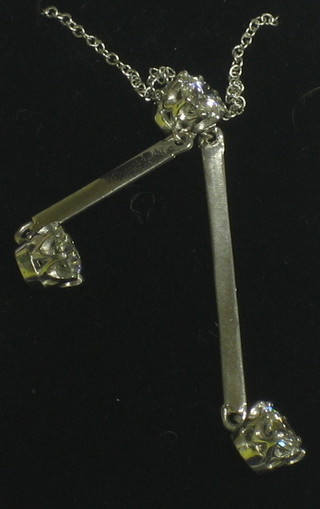 A lady's very attractive 18ct white gold drop diamond pendant set 3 diamonds (approx 1.20ct)