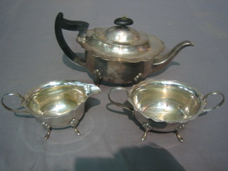 An oval silver plated 3 piece tea service comprising teapot, twin handled sugar bowl and cream jug