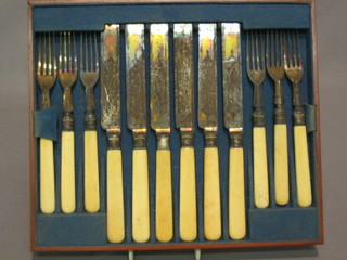 A set of 6 Victorian silver plated fruit knives and forks