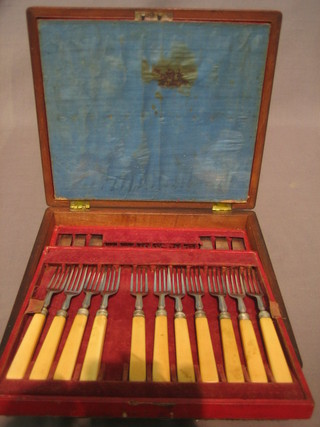 A set of 6 19th Century silver plated fruit knives and forks together with 11 fruit forks, cased