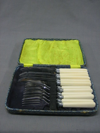 A set of 6 silver plated fish knives and forks