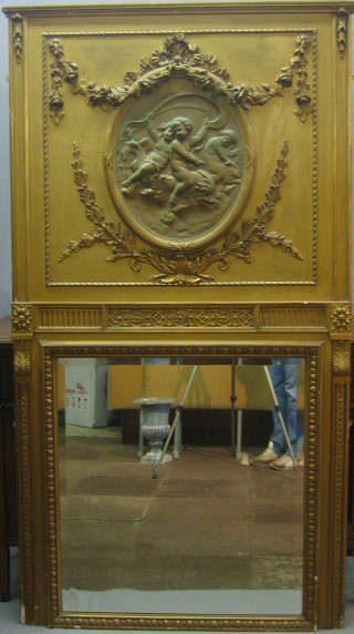 A square bevelled plate over mantel mirror contained in a gilt plaster frame surmounted by an oval plaque depicting cherubs 78"