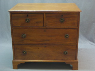A 19th Century mahogany chest of 2 short and 2 long drawers with brass ring neck drop handles, raised on bracket feet 32"