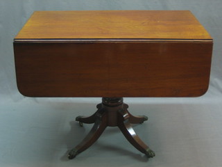 A 19th Century mahogany pedestal Pembroke table fitted a frieze drawer, raised on pillar and tripod supports 36"