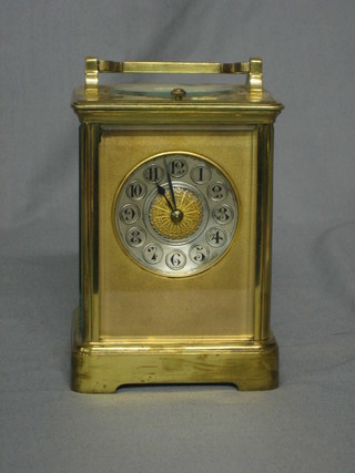 A 19th Century French 8 day repeating carriage clock contained in a gilt metal case