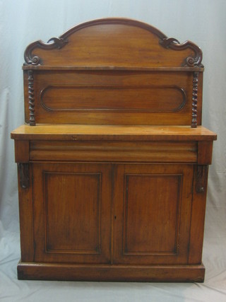 A Victorian mahogany chiffonier with raised back, the base fitted a drawer above a double cupboard, raised on a platform base 42"