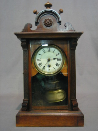 An American shelf clock with painted dial and Roman numerals contained in a walnut case
