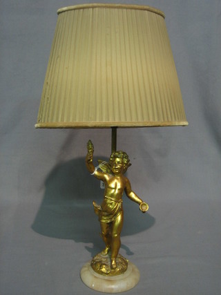 A gilt plaster table lamp in the form of a standing cherub 21" (f and r)